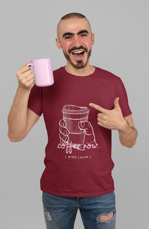 Man wearing the Coffee Now Wine Later tee in maroon, holding a mug